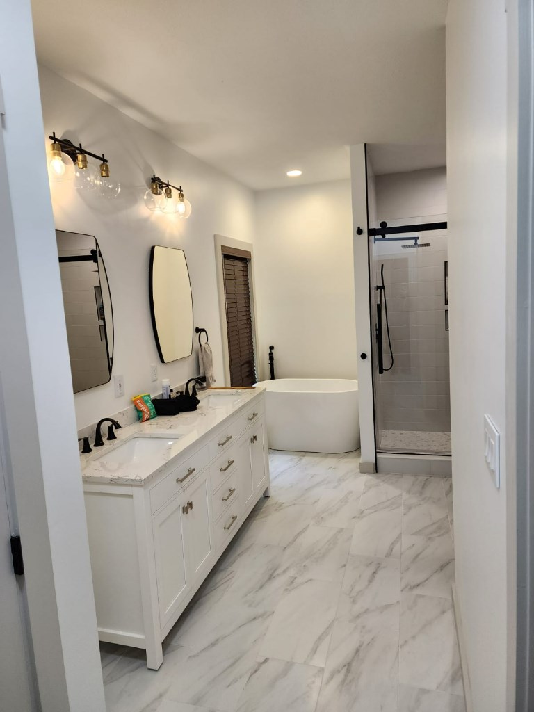 411 Delta Way Blue Ridge, GA 30513 - Photo 10 of 35 a spacious bathroom with a double vanity sink mirror and shower