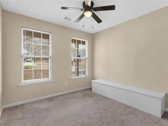 a view of a hallway with a staircase
