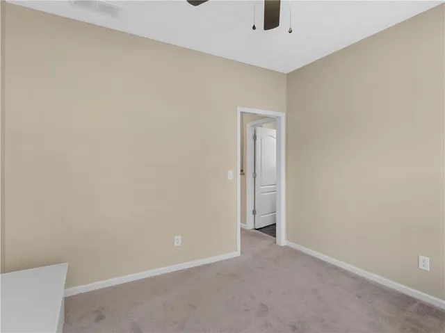 a view of a hallway with staircase