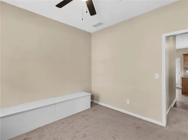a view of staircase with railing and a window