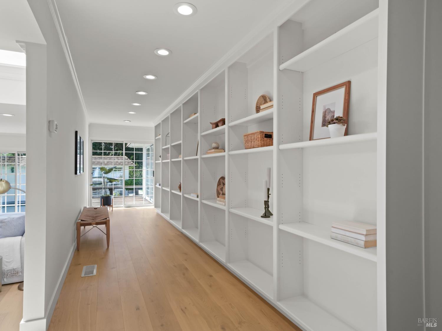 148 Dominican Drive San Rafael, CA 94901 - Photo 8 of 60 a view of a hallway with wooden floor and windows