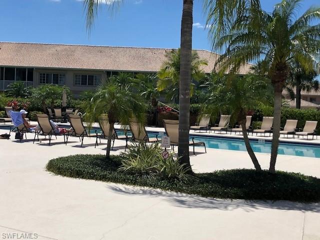9009 Michael Circle, Unit 1110 Naples, FL 34113 - Photo 21 of 27 a view of outdoor space yard and lake view
