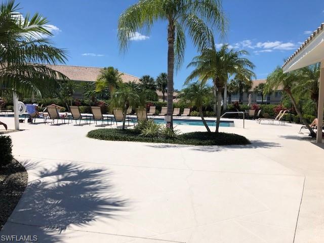 9009 Michael Circle, Unit 1110 Naples, FL 34113 - Photo 23 of 27 a view of outdoor space with palm trees