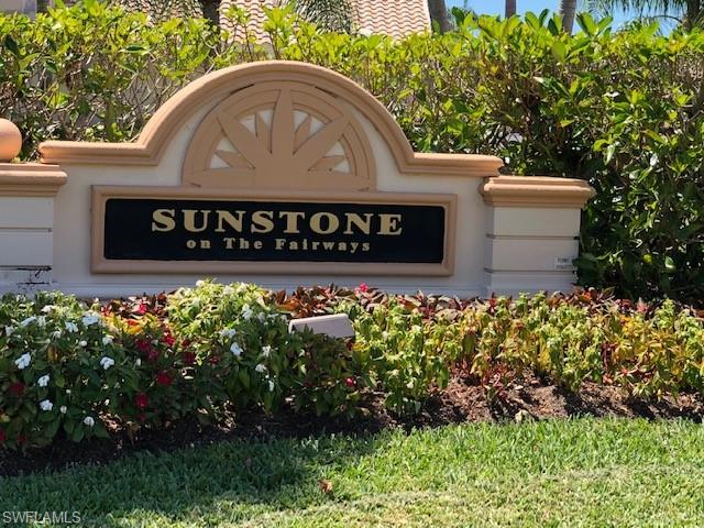 9009 Michael Circle, Unit 1110 Naples, FL 34113 - Photo 25 of 27 a sign that is sitting in front of flowers