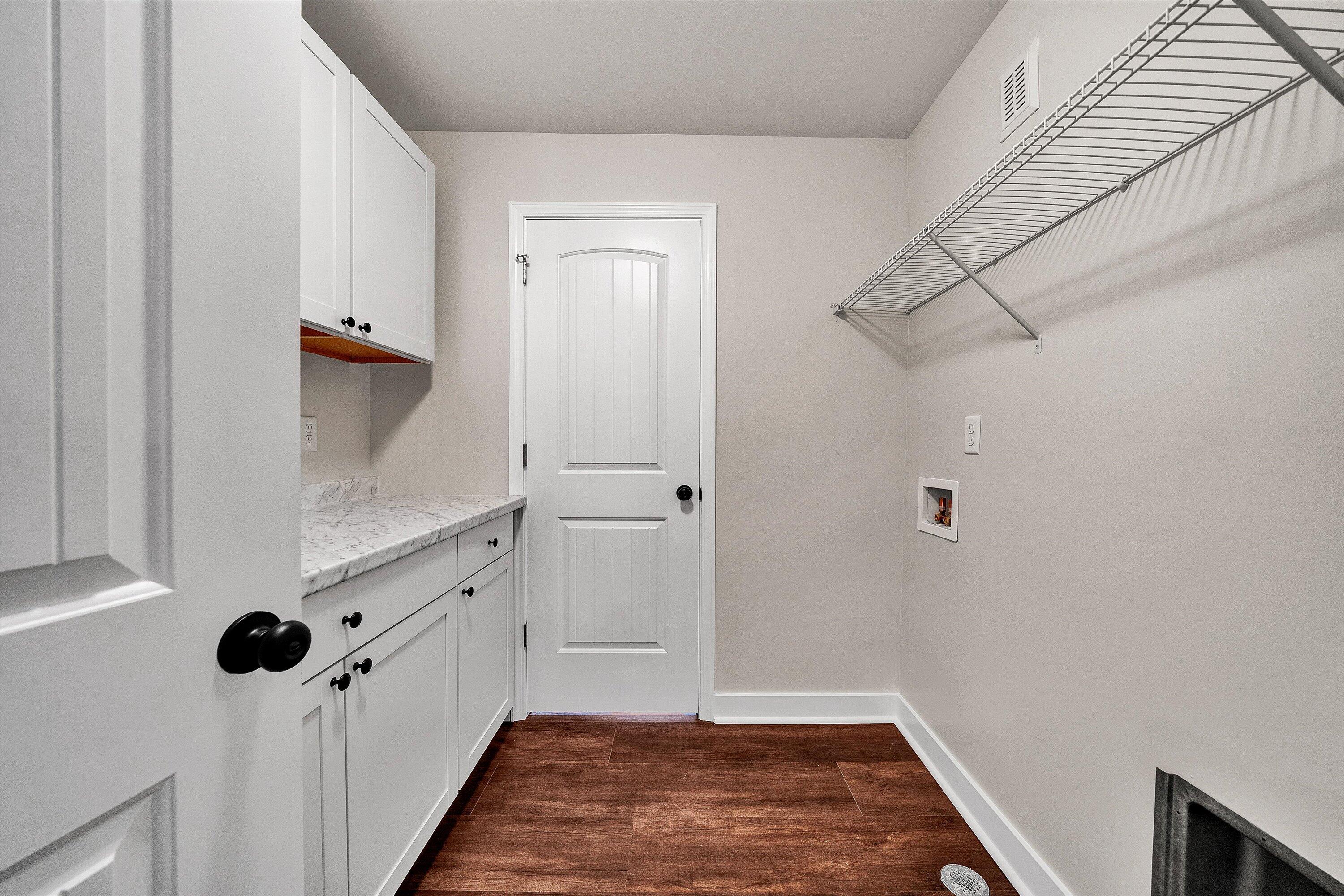 251 Meadow Branch Road Boones Mill, VA 24065 - Photo 16 of 34 a view of a room with wooden floor and white walls