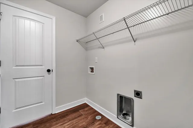 a view of a storage & utility room with wooden floor
