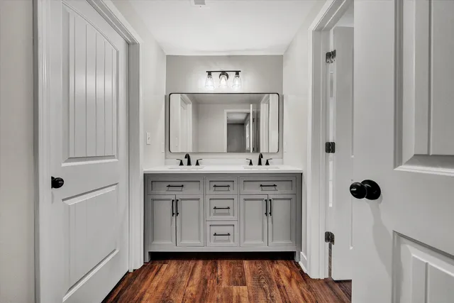 a bathroom with a sink and a mirror