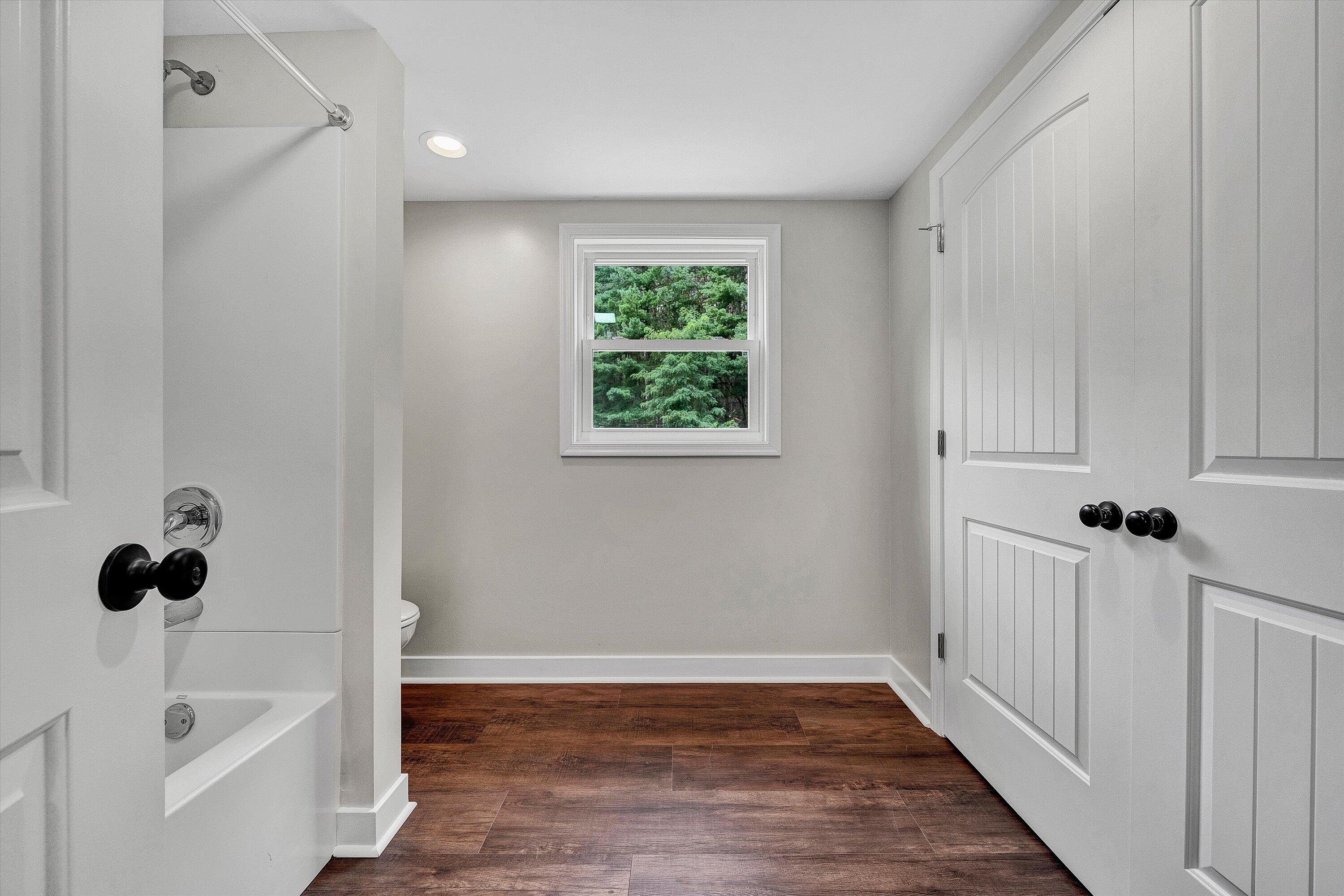 251 Meadow Branch Road Boones Mill, VA 24065 - Photo 22 of 34 a view of a bathroom with a tub and sink