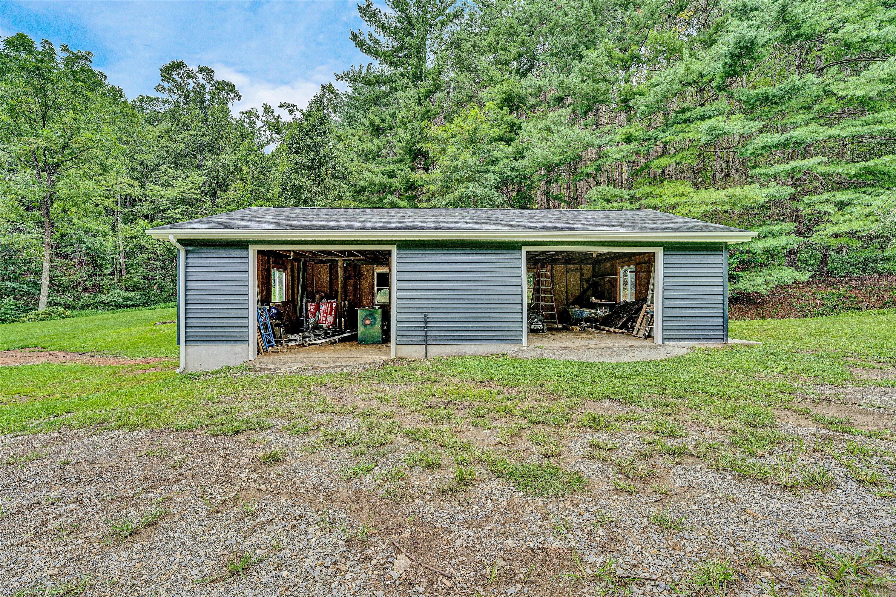 251 Meadow Branch Road Boones Mill, VA 24065 - Photo 29 of 34 a view of a house with backyard and garden