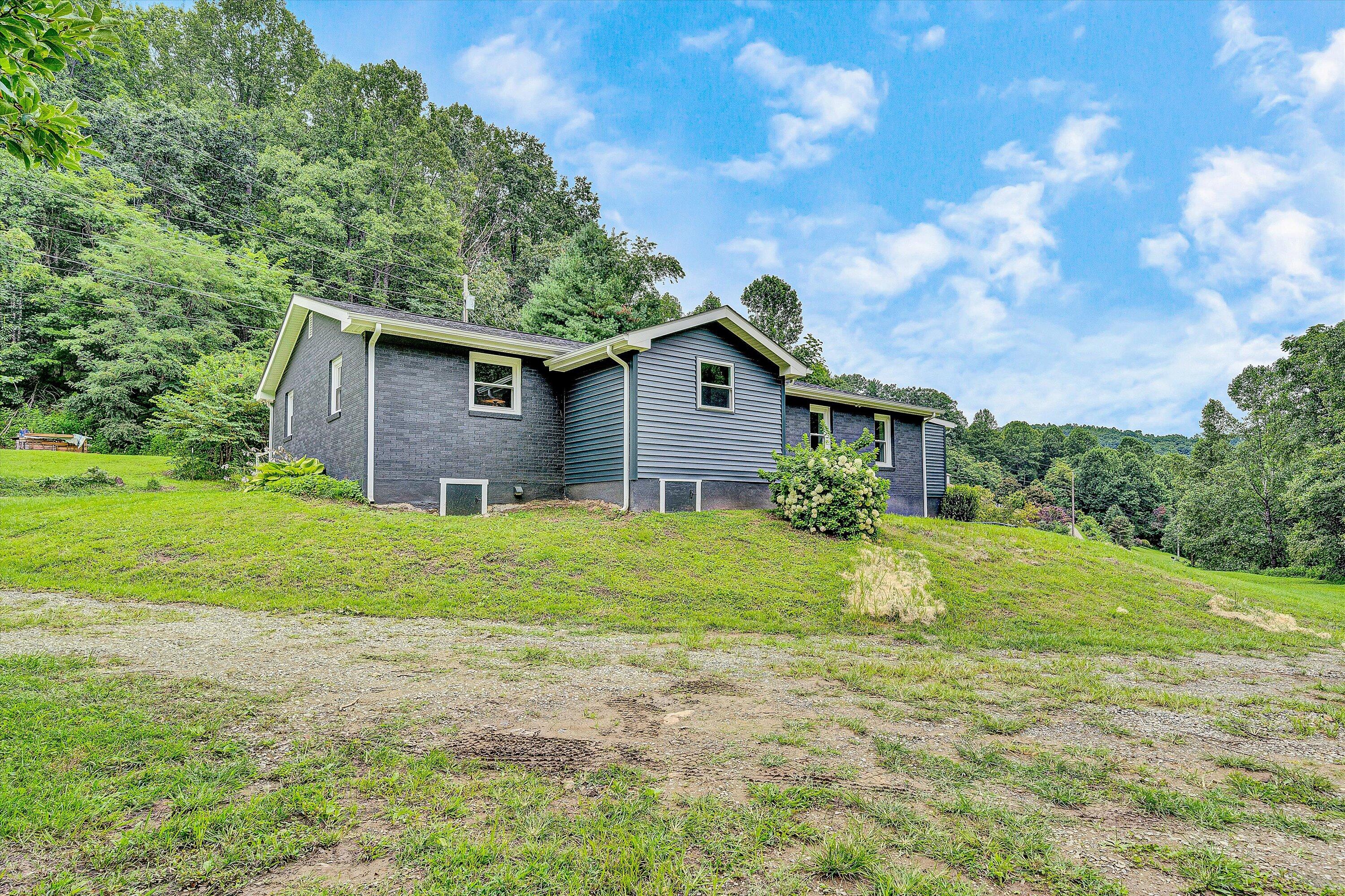 251 Meadow Branch Road Boones Mill, VA 24065 - Photo 30 of 34 a front view of house with yard and green space