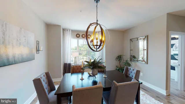 a living room with furniture a mirror and a window