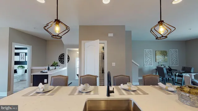 a large kitchen with a table and chairs