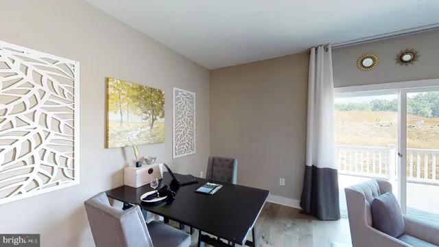 a bedroom with a bed flat screen tv and window