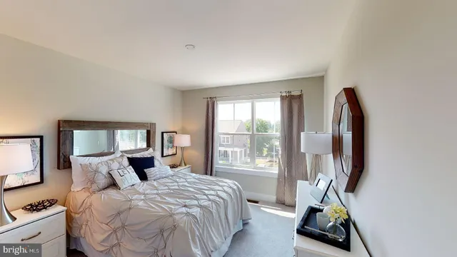 a living room with furniture a lamp and a window