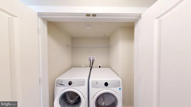 a spacious bathroom with a tub sink and mirror