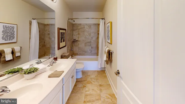 a bedroom with a bed and a night stand