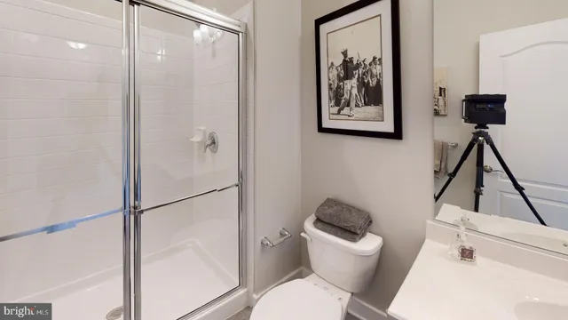 a bedroom with a bed and a mirror