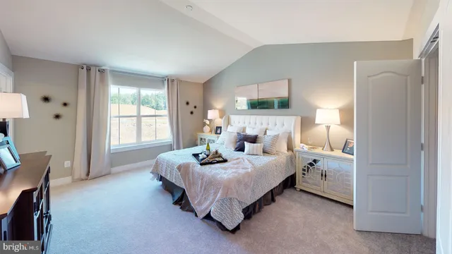 a dining room with furniture potted plants and wooden floor