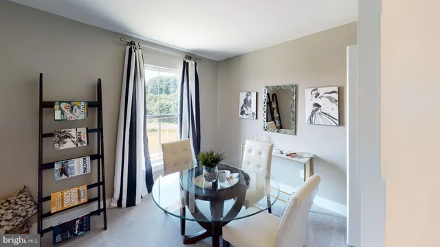 a kitchen with stainless steel appliances kitchen island granite countertop a refrigerator and a stove top oven