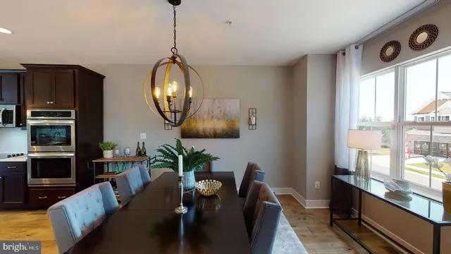 a view of a livingroom with furniture and a window