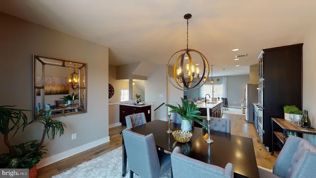 a living room with furniture a chandelier and a flat screen tv