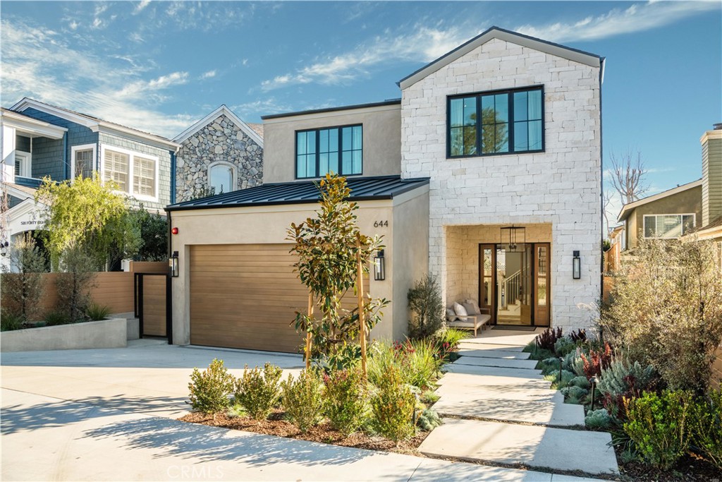 644 29th Street Manhattan Beach, CA 90266 - Photo 1 of 41 a front view of a house with a yard