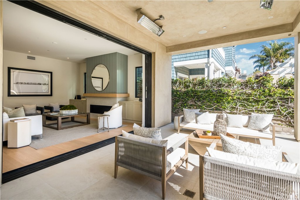 644 29th Street Manhattan Beach, CA 90266 - Photo 11 of 41 a living room with fireplace furniture and a large window