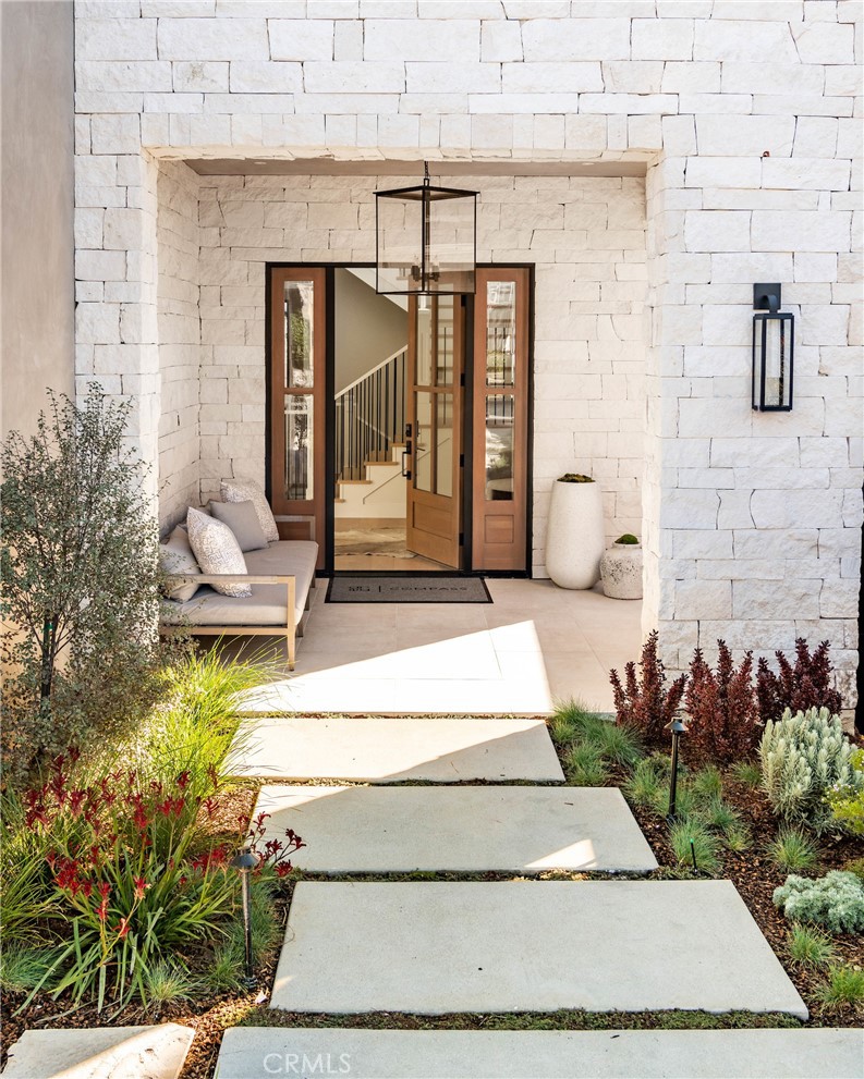 644 29th Street Manhattan Beach, CA 90266 - Photo 2 of 41 a building with potted plants in front of it