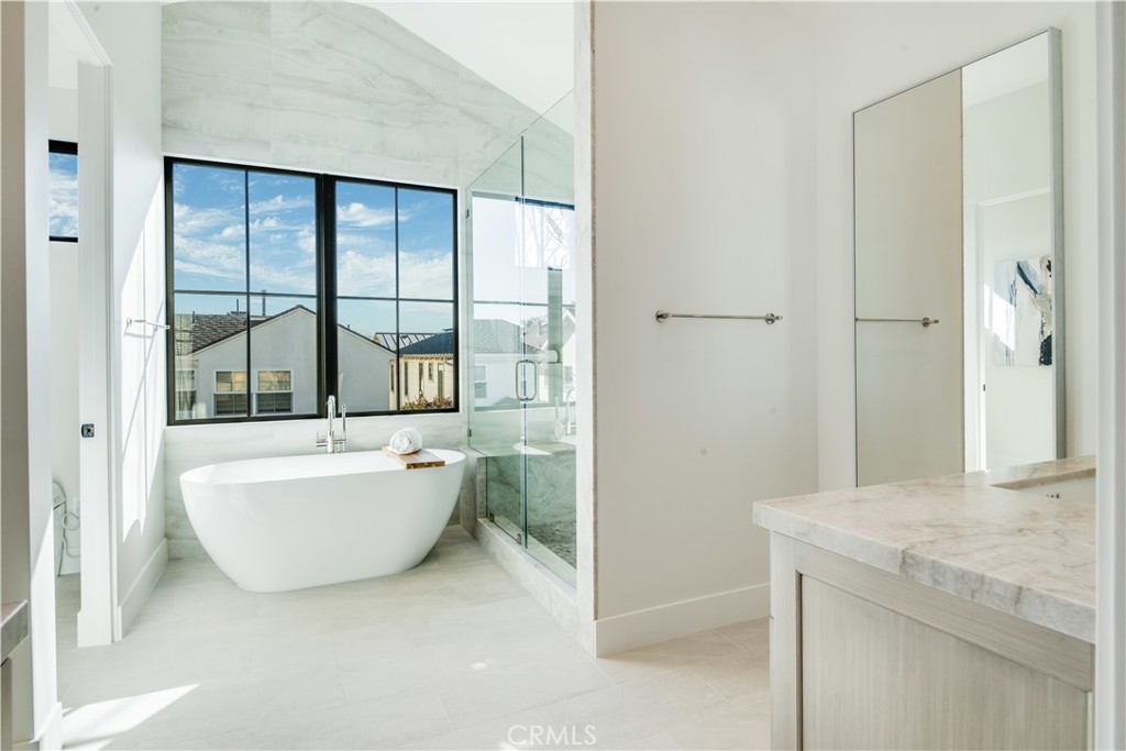 644 29th Street Manhattan Beach, CA 90266 - Photo 21 of 41 a bathroom with a granite countertop sink and a bathtub
