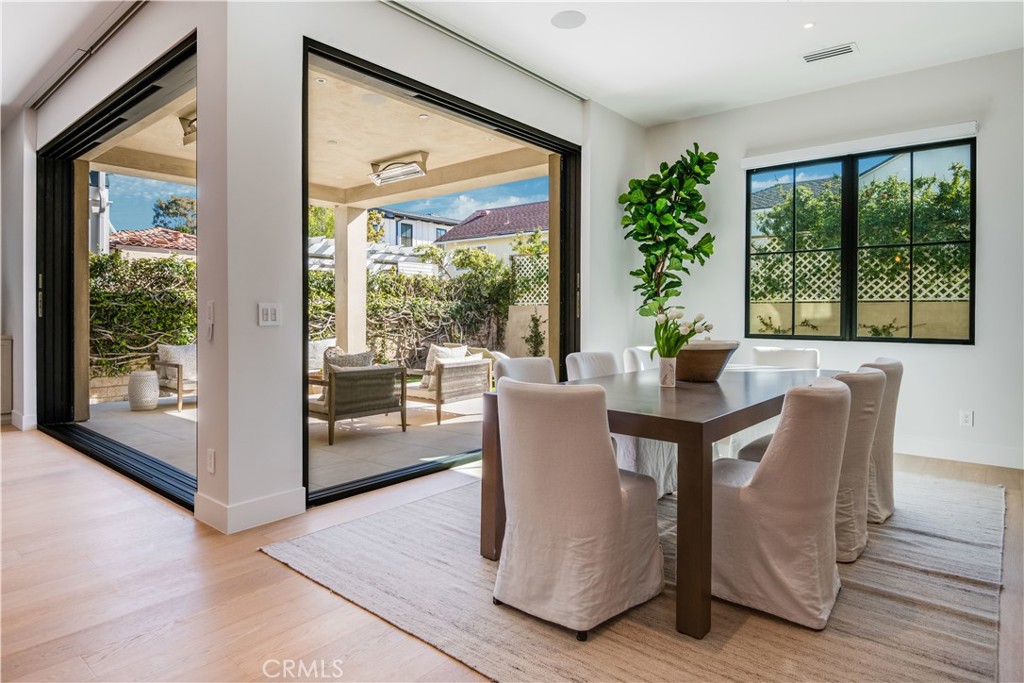 644 29th Street Manhattan Beach, CA 90266 - Photo 10 of 41 a view of a dining room with furniture large windows and wooden floor