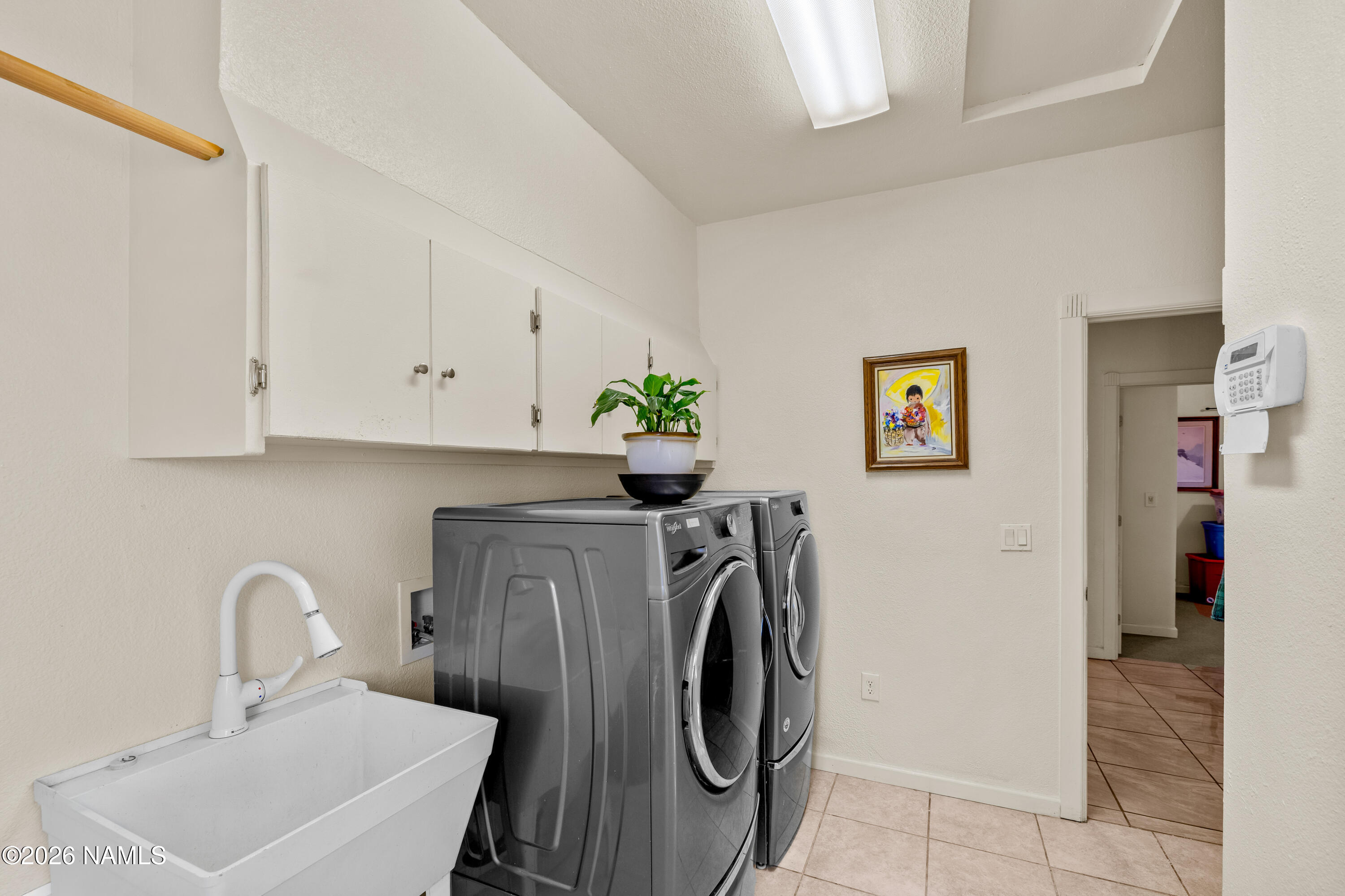 8187 Cassity Trail Williams, AZ 86046 - Photo 15 of 50 a utility room with sink dryer and washer