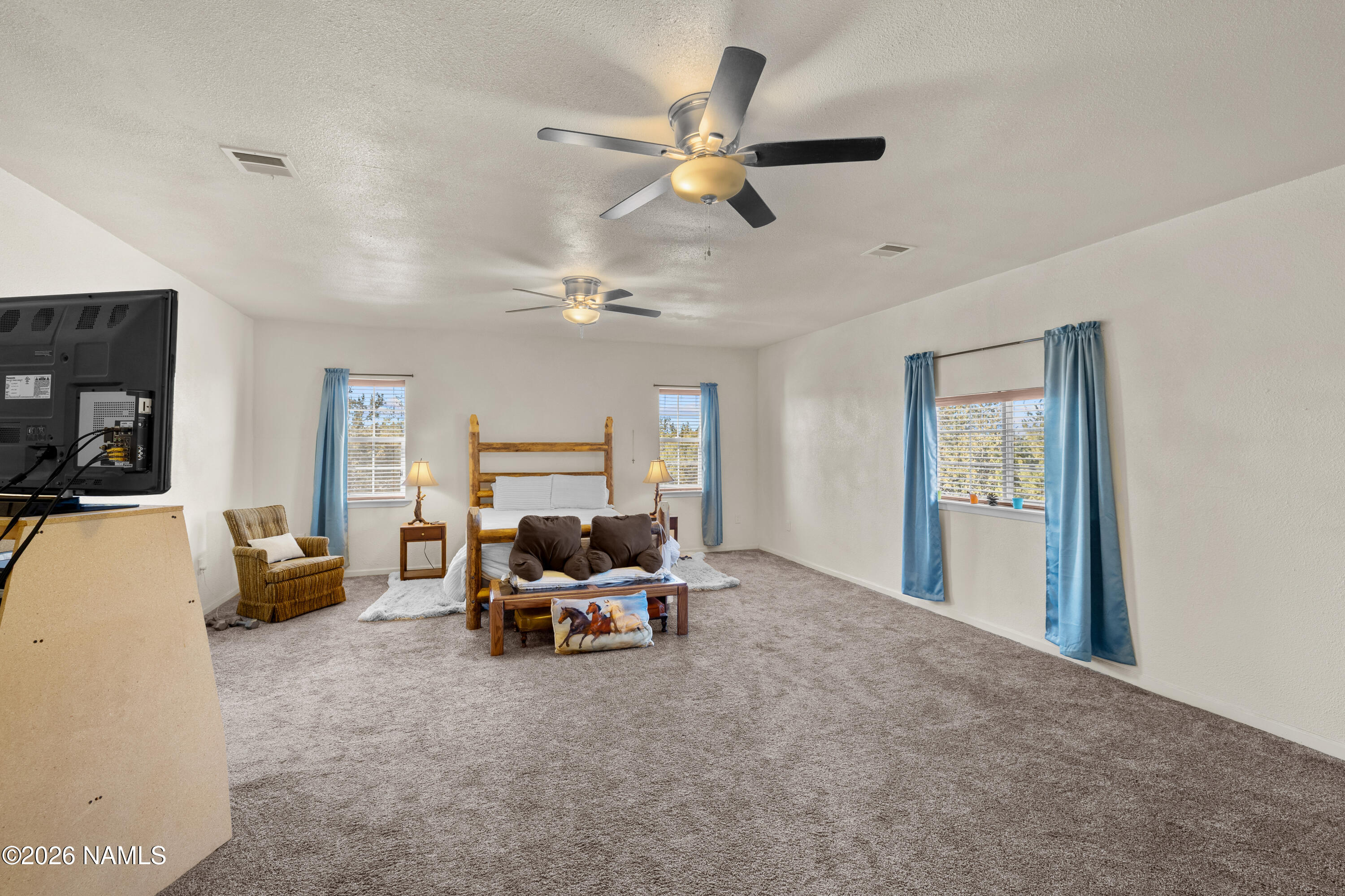 8187 Cassity Trail Williams, AZ 86046 - Photo 16 of 50 a living room with furniture and a ceiling fan