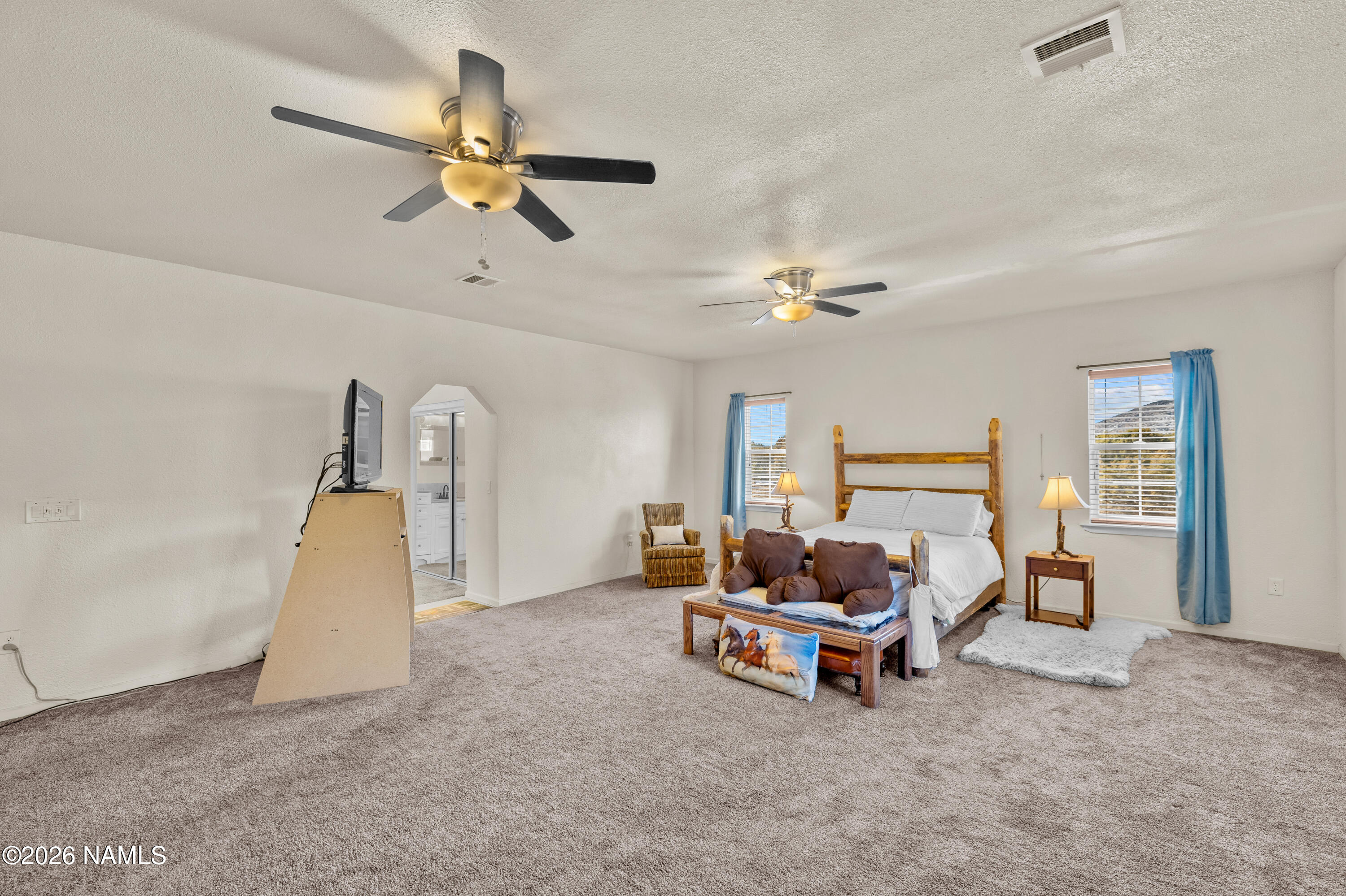 8187 Cassity Trail Williams, AZ 86046 - Photo 17 of 50 a living room with furniture and a ceiling fan