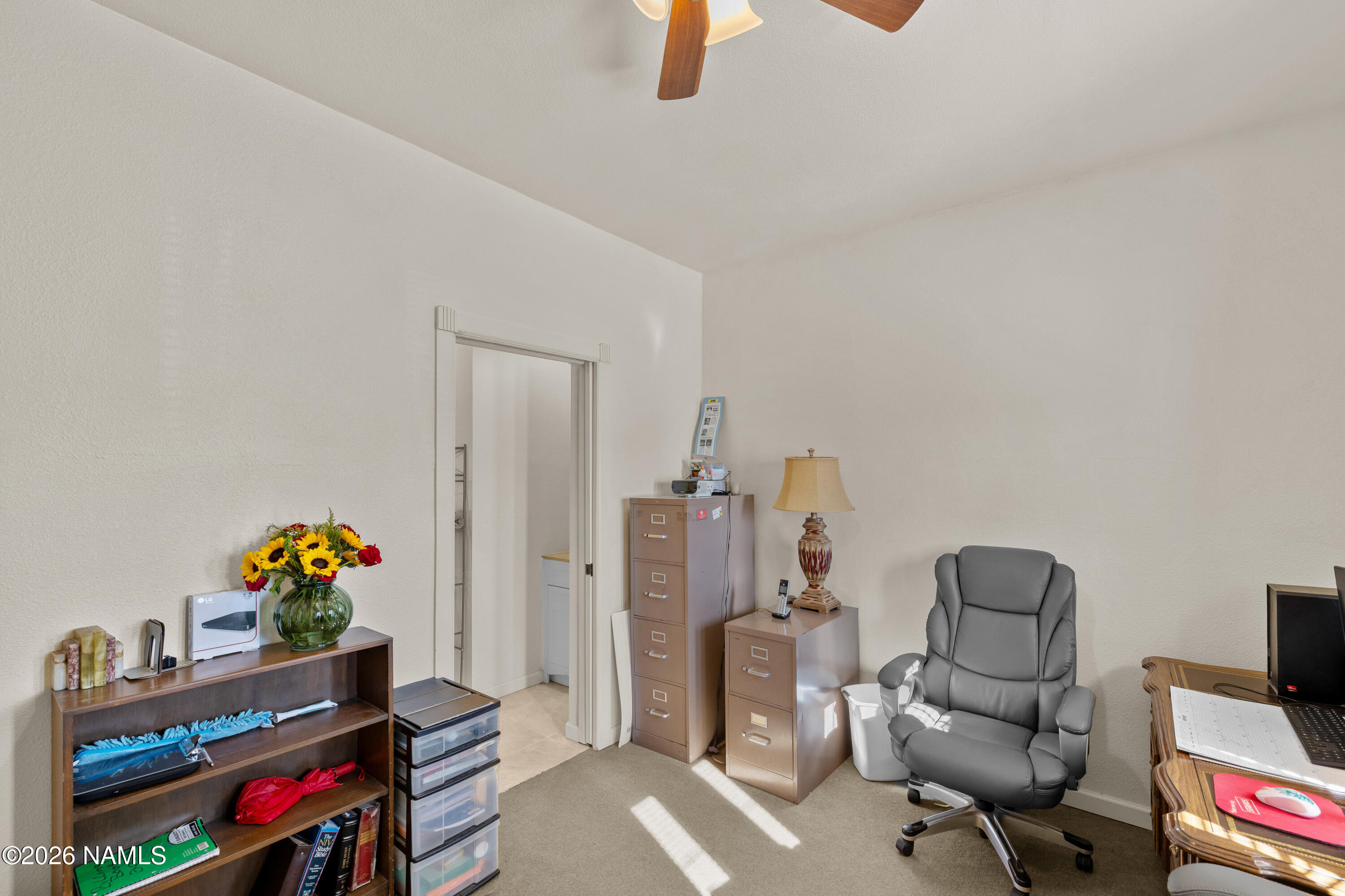 8187 Cassity Trail Williams, AZ 86046 - Photo 26 of 50 a workspace with furniture and a wooden floor