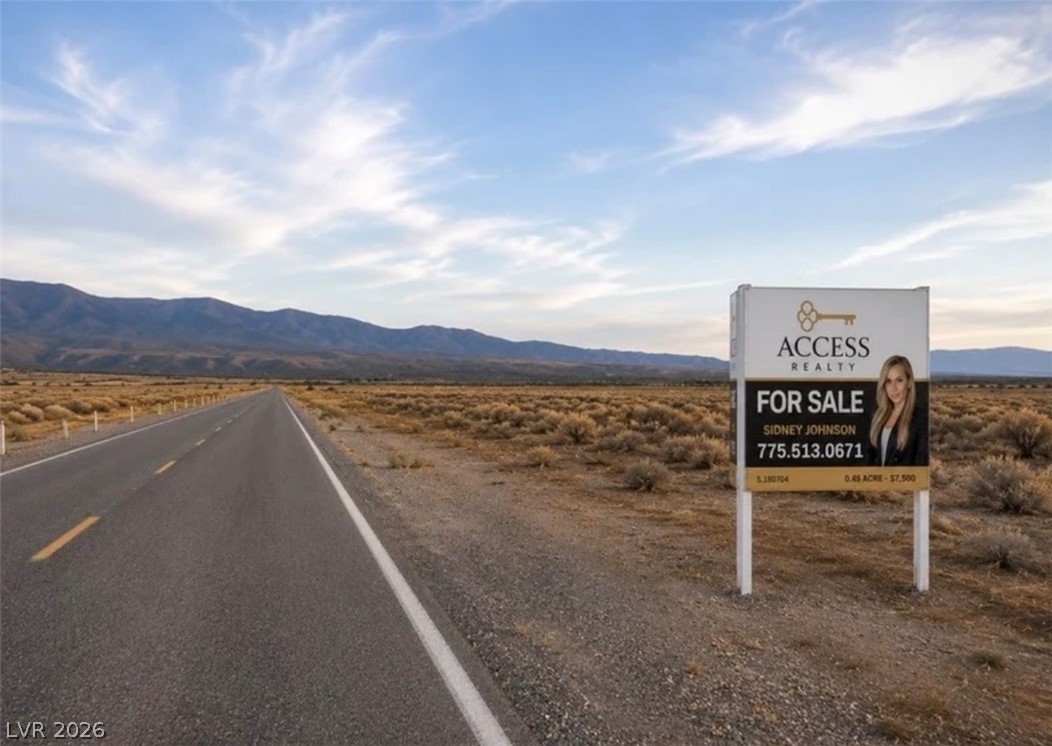 4481 East Gamebird Road Pahrump, NV 89048 - Photo 3 of 6 A vast, open lot with distant mountains offers an ideal blank canvas for development.