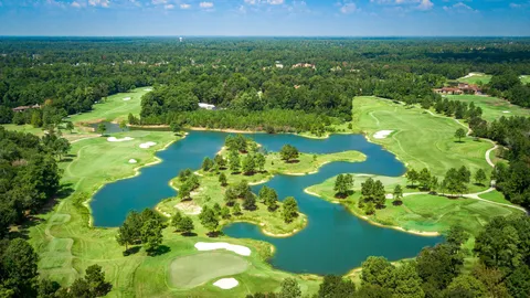 a view of a golf course with a swimming pool
