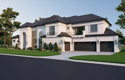 a front view of a house with a garden and yard