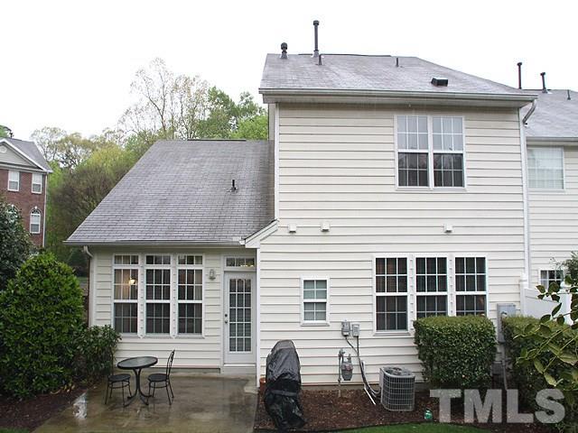 6820 Middleboro Drive Raleigh, NC 27612 - Photo 14 of 14 a front view of a house with a yard and seating space