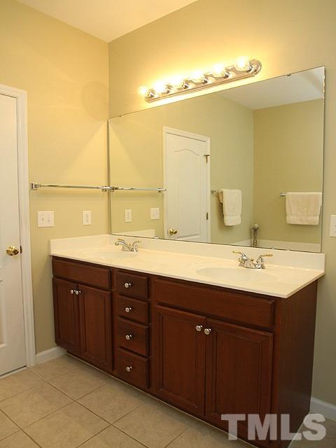 6820 Middleboro Drive Raleigh, NC 27612 - Photo 8 of 14 a bathroom with a sink and a mirror