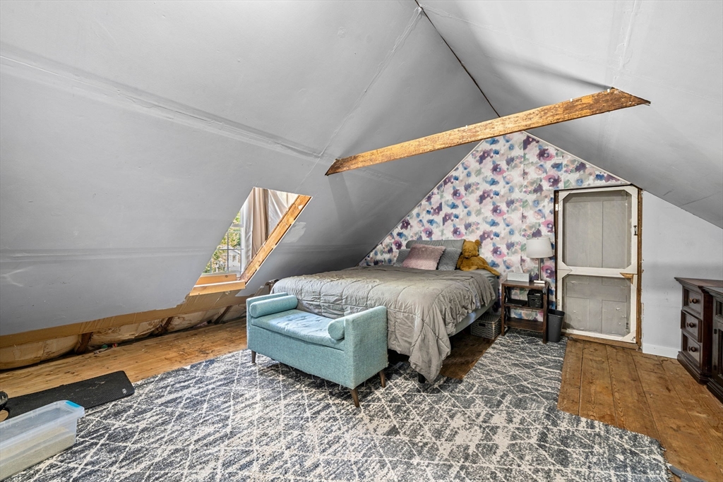 600 Main Street Ashby, MA 01431 - Photo 33 of 40 a bed room with a bed and a chair