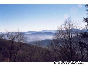 C9 Briarwood Drive Maggie Valley, NC 28751 - Photo 1 of 1 a view of a house with a mountain in the background