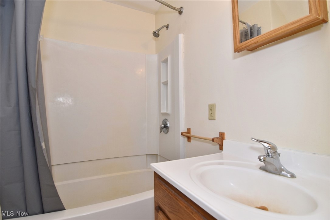 14405 Madison Road Middlefield, OH 44062 - Photo 30 of 30 Bathroom with shower / tub combo with curtain and vanity