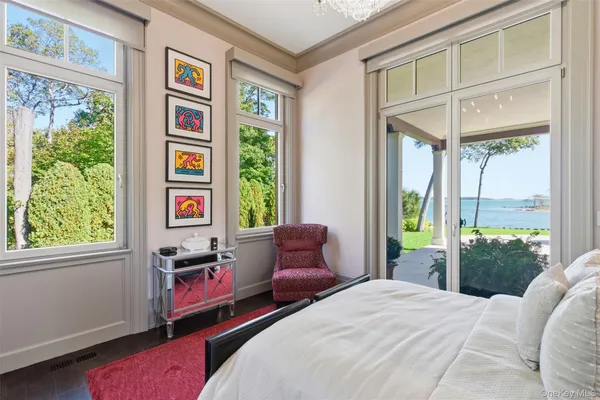 a bedroom with furniture and a window