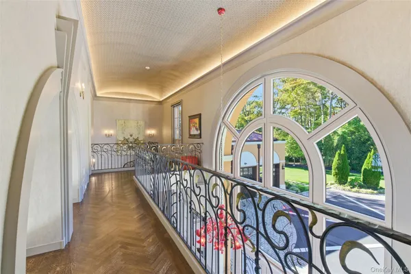 a view of a bedroom with large windows and a large bed