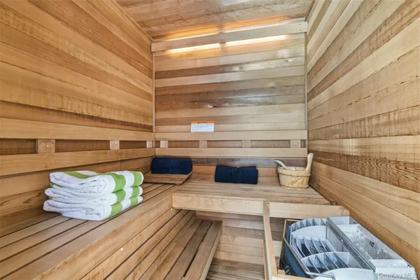 a bedroom with furniture and a large window