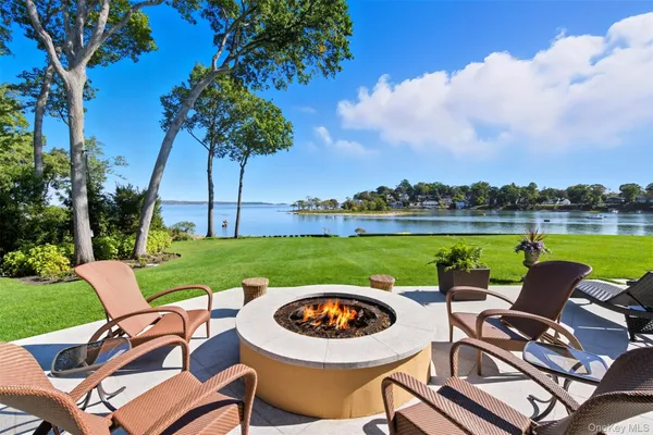 an aerial view of a house with garden space and lake view