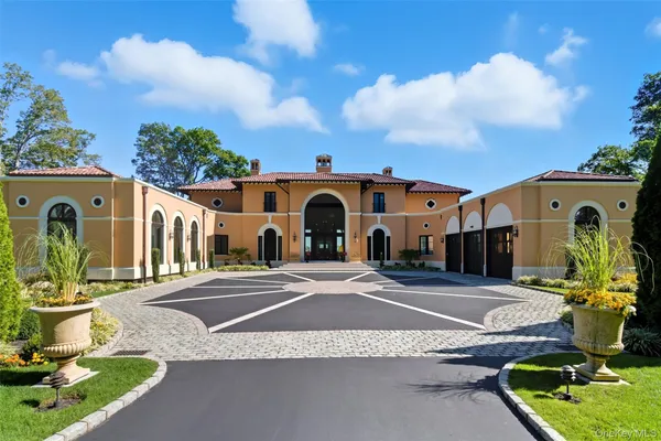 an aerial view of a house with a lake view
