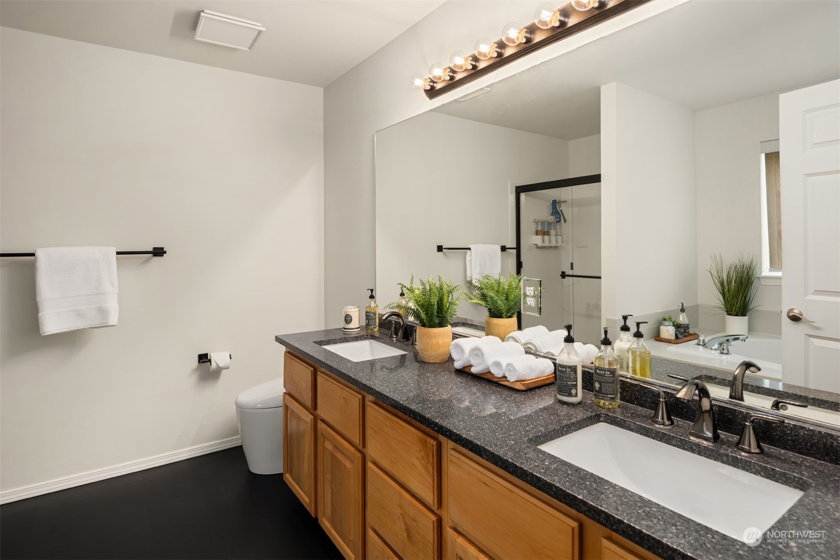 23021 21st Avenue Southeast Bothell, WA 98021 - Photo 16 of 29 a bathroom with double sink and a mirror