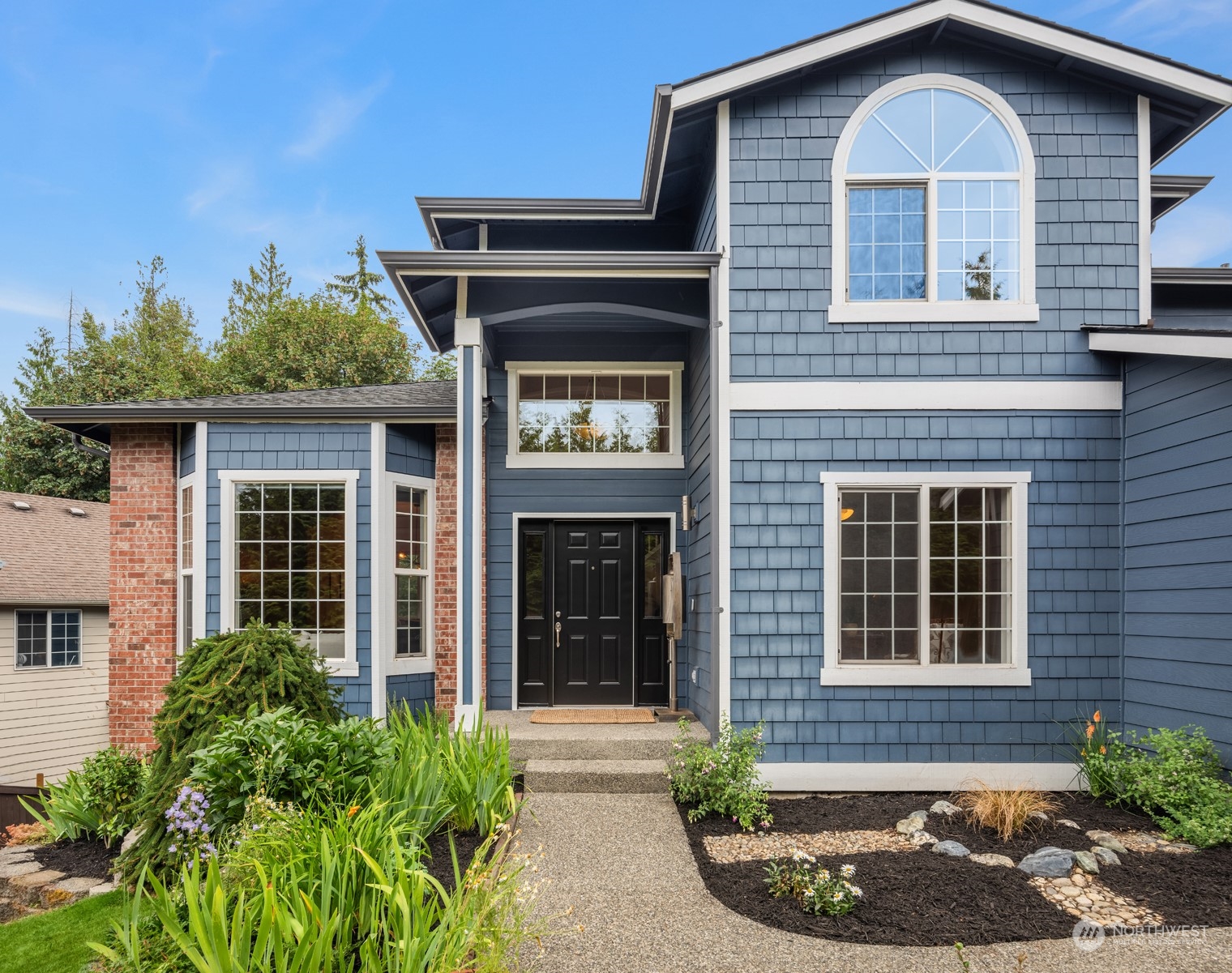 23021 21st Avenue Southeast Bothell, WA 98021 - Photo 2 of 29 a front view of a house with garden