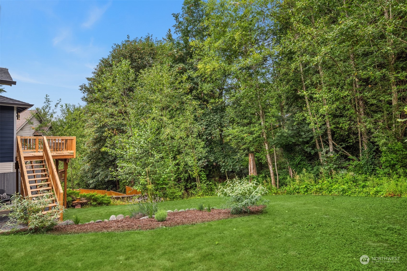23021 21st Avenue Southeast Bothell, WA 98021 - Photo 26 of 29 a view of a backyard with plants and large trees